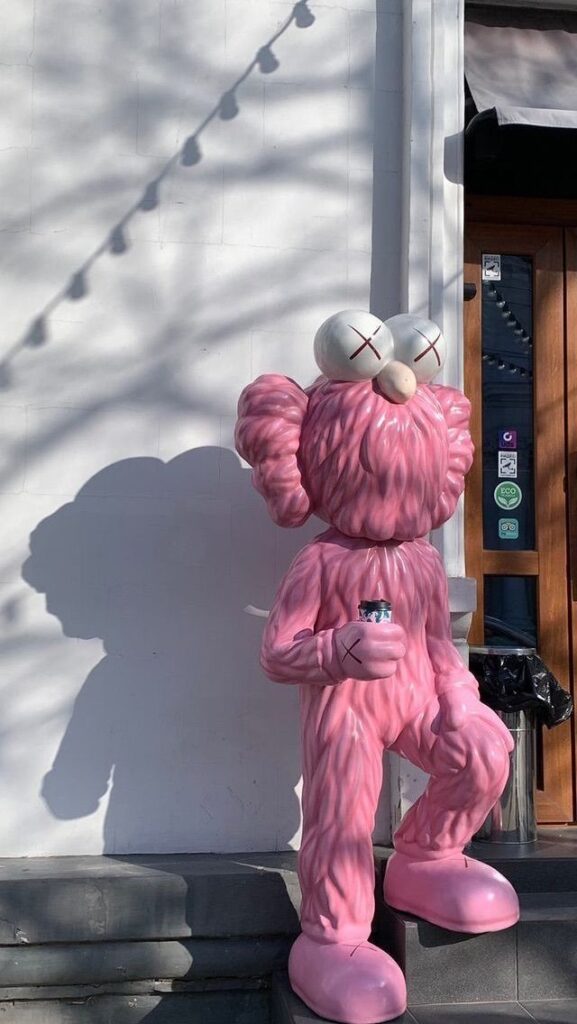 Pink Kaws With Black Background